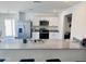 Modern kitchen with stainless steel appliances, granite countertops, and a breakfast bar at 1418 E Peggy Dr, Casa Grande, AZ 85122