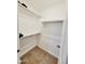 Bright and airy walk-in closet features shelving and space for efficient organization and easy access at 1418 E Peggy Dr, Casa Grande, AZ 85122