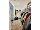 This walk-in closet is equipped with shelving to keep your clothing and personal items neatly organized at 1418 E Peggy Dr, Casa Grande, AZ 85122