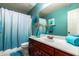 Bathroom featuring an aqua color scheme, a single sink, and a decorative mirror at 1422 S Colt Dr, Gilbert, AZ 85296
