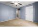 Bedroom featuring a ceiling fan, carpet, and easy access to other areas of the home at 1422 S Colt Dr, Gilbert, AZ 85296
