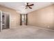 Large bedroom with ceiling fan and windows dressed with draperies at 1422 S Colt Dr, Gilbert, AZ 85296