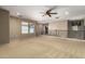 Open bonus room featuring a skylight, ceiling fan, and carpet throughout the upper level at 1422 S Colt Dr, Gilbert, AZ 85296
