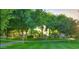 Lush green space with manicured lawns, mature trees, and park benches, creating a serene outdoor environment at 1422 S Colt Dr, Gilbert, AZ 85296