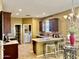Bright kitchen with stainless steel appliances, breakfast bar, and access to laundry room at 1422 S Colt Dr, Gilbert, AZ 85296