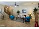 Inviting living room featuring stylish furniture, neutral walls, ceiling fan, and tiled floors at 1422 S Colt Dr, Gilbert, AZ 85296