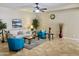 Comfortable living room with a sofa, two chairs, a ceiling fan, and tiled floors at 1422 S Colt Dr, Gilbert, AZ 85296
