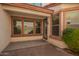 Inviting covered patio with a concrete surface and plenty of natural light from the multiple windows and nearby door at 1422 S Colt Dr, Gilbert, AZ 85296