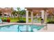 Inviting community pool, complete with chairs, tables, and a covered gazebo, is perfect for summer relaxation at 1422 S Colt Dr, Gilbert, AZ 85296