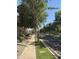 Scenic street view showcasing mature trees, sidewalks, and well-maintained landscaping at 1422 S Colt Dr, Gilbert, AZ 85296
