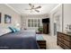 Inviting main bedroom with a ceiling fan, natural light, and ensuite bathroom access at 1431 E Winged Foot Dr, Chandler, AZ 85249