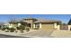 Charming single-story home boasts a well-manicured front yard and an attached two-car garage at 15960 W Bonitos Dr, Goodyear, AZ 85395