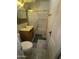 Bathroom featuring tiled floors, a sink with vanity, a standard toilet, and a shower-tub combo at 1637 E Brill St, Phoenix, AZ 85006