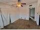 This bedroom features hardwood floors and a ceiling fan, offering potential for a comfortable living space at 1637 E Brill St, Phoenix, AZ 85006