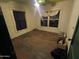 Vacant bedroom with original hardwood floors and natural light from two windows at 1637 E Brill St, Phoenix, AZ 85006