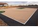 Community basketball court with playground and ramada, creating a recreational space for residents at 17353 W Via De Luna Dr, Surprise, AZ 85387