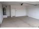 Spacious two car garage with ample room and concrete flooring at 17353 W Via De Luna Dr, Surprise, AZ 85387