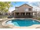 Inviting backyard with a swimming pool, spa, covered patio, and views of the house at 17629 N 24Th Way, Phoenix, AZ 85032