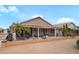 Home backyard featuring a covered patio and desert landscaping at 17637 N Goldwater Dr, Surprise, AZ 85374