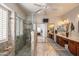 Primary bath with dual sinks, walk-in shower and tub at 17637 N Goldwater Dr, Surprise, AZ 85374