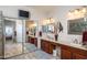 Primary bath with dual sinks, large mirror and natural lighting at 17637 N Goldwater Dr, Surprise, AZ 85374