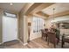Elegant dining area with tray ceiling, wood floors, and modern chandelier at 17637 N Goldwater Dr, Surprise, AZ 85374