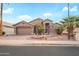 Charming single-story home featuring a three car garage and desert landscaping at 17637 N Goldwater Dr, Surprise, AZ 85374