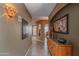 Inviting hallway with warm tones, decorative lighting, and elegant artwork at 17637 N Goldwater Dr, Surprise, AZ 85374