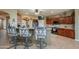Spacious kitchen with large island, breakfast bar and stainless steel appliances at 17637 N Goldwater Dr, Surprise, AZ 85374