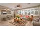Inviting living room featuring wood floors, ceiling fan, and natural light at 17637 N Goldwater Dr, Surprise, AZ 85374