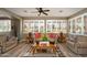 Inviting living room featuring wood floors, ceiling fan, and natural light at 17637 N Goldwater Dr, Surprise, AZ 85374