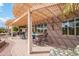 Inviting covered patio with brick flooring, outdoor seating, and a decorative pergola at 17637 N Goldwater Dr, Surprise, AZ 85374