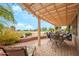 Inviting patio with an outdoor dining area and comfortable lounge seating with golf course views at 17637 N Goldwater Dr, Surprise, AZ 85374
