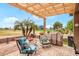 Inviting covered patio features golf course views and cozy seating at 17637 N Goldwater Dr, Surprise, AZ 85374
