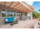 Inviting patio with an outdoor dining area, comfortable lounge seating and backyard views at 17637 N Goldwater Dr, Surprise, AZ 85374