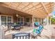 Inviting covered patio with an outdoor dining area and comfortable lounge seating at 17637 N Goldwater Dr, Surprise, AZ 85374