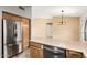 Kitchen area with stainless steel appliances, tile floors, and wood cabinets at 1831 E Toledo St, Gilbert, AZ 85295