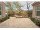 Serene backyard with travertine pavers, built-in planters, and mature landscaping at 18515 N 94Th St, Scottsdale, AZ 85255