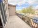 View of spacious balcony with iron railing and exterior wall, complemented by tree views at 18515 N 94Th St, Scottsdale, AZ 85255