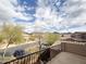 Balcony view featuring neighborhood street, landscaping and mountain views under a partly cloudy sky at 18515 N 94Th St, Scottsdale, AZ 85255