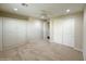 This bedroom has neutral carpet, ceiling fan and large closet with white bi-fold doors at 18515 N 94Th St, Scottsdale, AZ 85255
