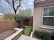 Charming courtyard features artificial turf, stone accents, and lush greenery at 18515 N 94Th St, Scottsdale, AZ 85255