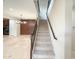 Inviting entryway with staircase, tile flooring, and modern lighting fixtures at 18515 N 94Th St, Scottsdale, AZ 85255