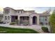 Charming exterior elevation of a two-story home featuring elegant architectural details and a welcoming entrance at 18515 N 94Th St, Scottsdale, AZ 85255