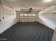Clean, spacious garage with a finished floor and overhead storage racks at 18515 N 94Th St, Scottsdale, AZ 85255