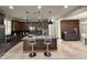 A modern kitchen features a center island with bar seating, stainless steel appliances, and ample storage at 18515 N 94Th St, Scottsdale, AZ 85255