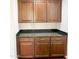 Wet bar features dark cabinets, granite countertops, and ample storage space at 18515 N 94Th St, Scottsdale, AZ 85255