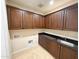Utility room features cabinets, granite countertop, a sink, and is equipped with washer/dryer hookups at 18515 N 94Th St, Scottsdale, AZ 85255