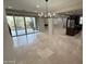 The living area connects to the kitchen and features a sliding glass door to the backyard at 18515 N 94Th St, Scottsdale, AZ 85255
