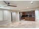 Open concept living area featuring tiled flooring, a modern ceiling fan, and plenty of light at 18515 N 94Th St, Scottsdale, AZ 85255